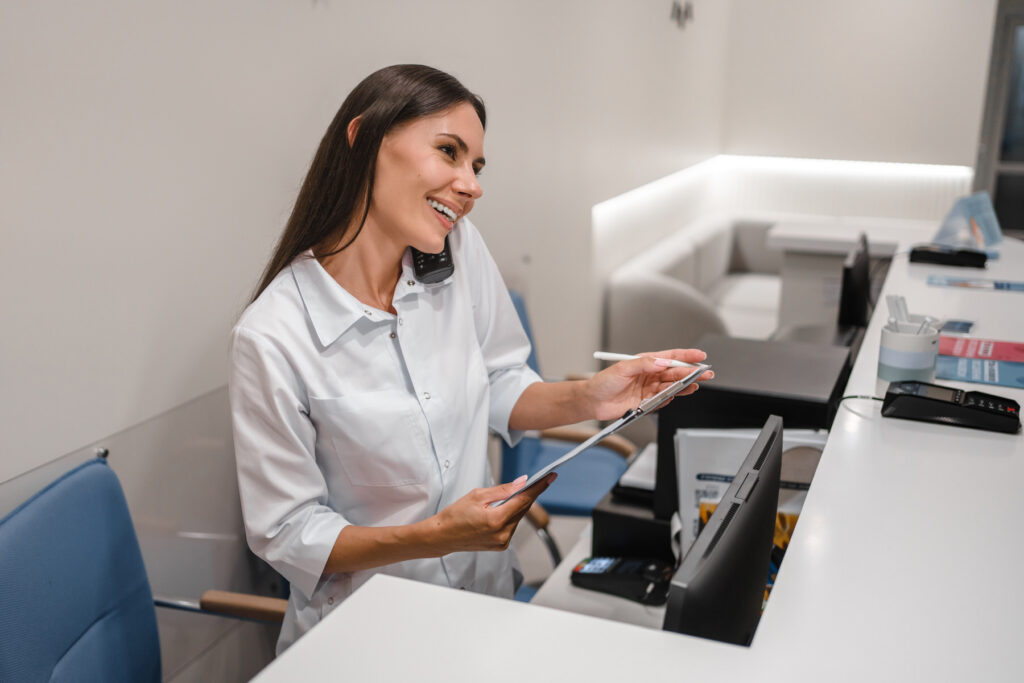 Female receptionist talking to someone on her phone