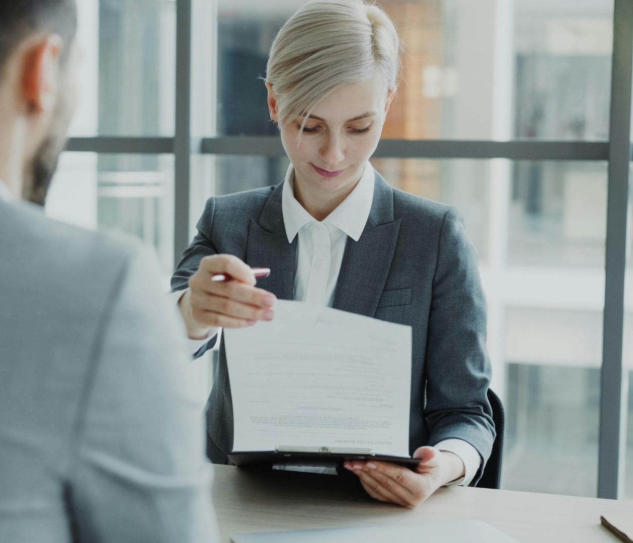 Picture of a blonde woman having a meeting with a colleague