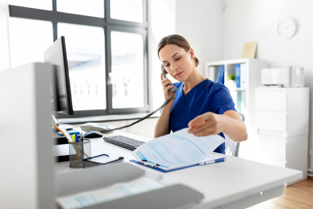 Medical professional worker working and talking to someone on the phone